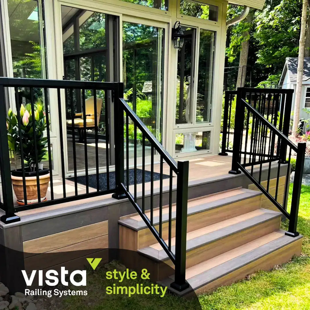Black metal railing system on wooden deck steps, modern outdoor design with glass windows