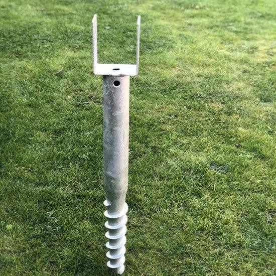 American ground screw U model metal no-dig ground anchor with helical screw base on grass