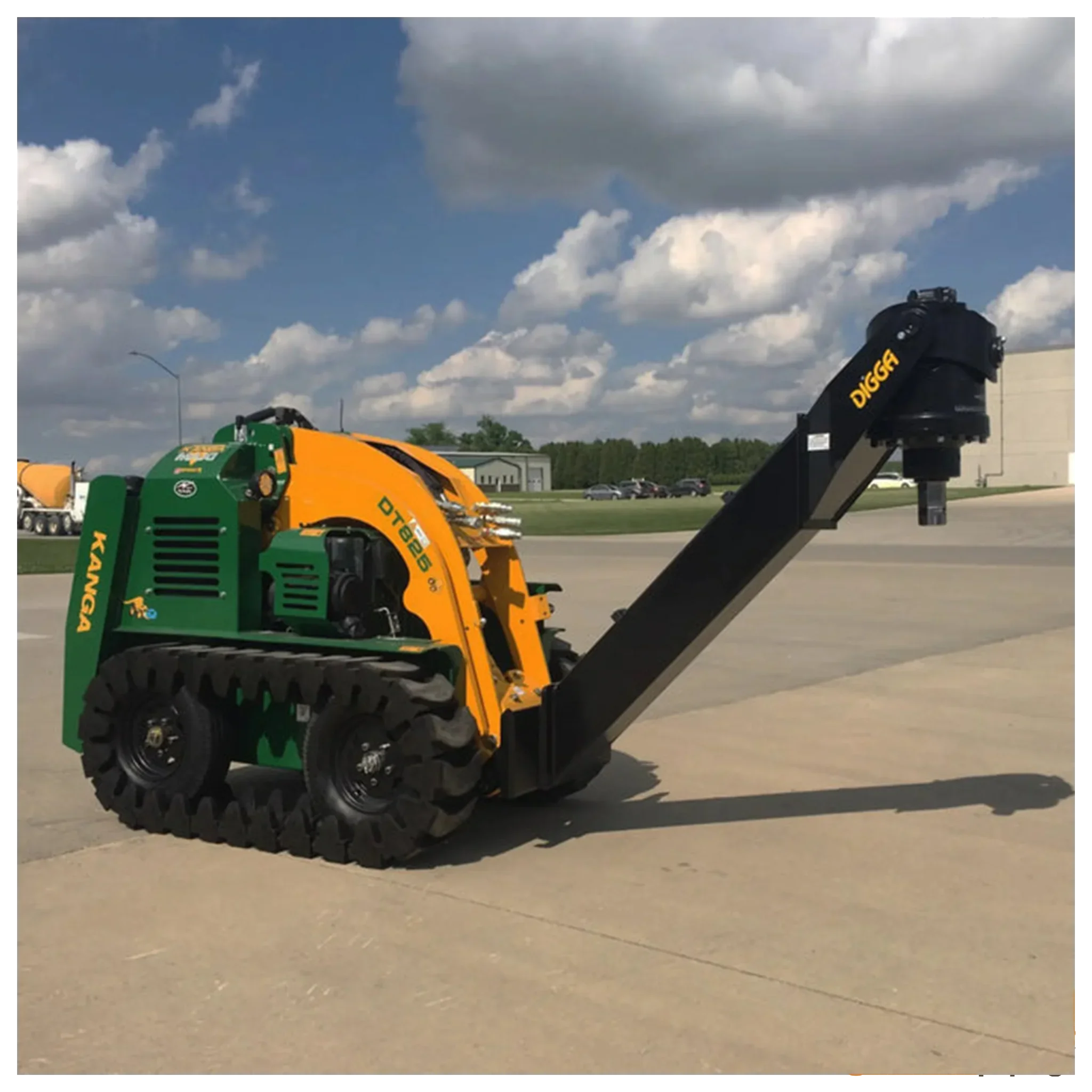 Kanga DT825 tracked mini skid steer with long black Digga auger attachment on concrete