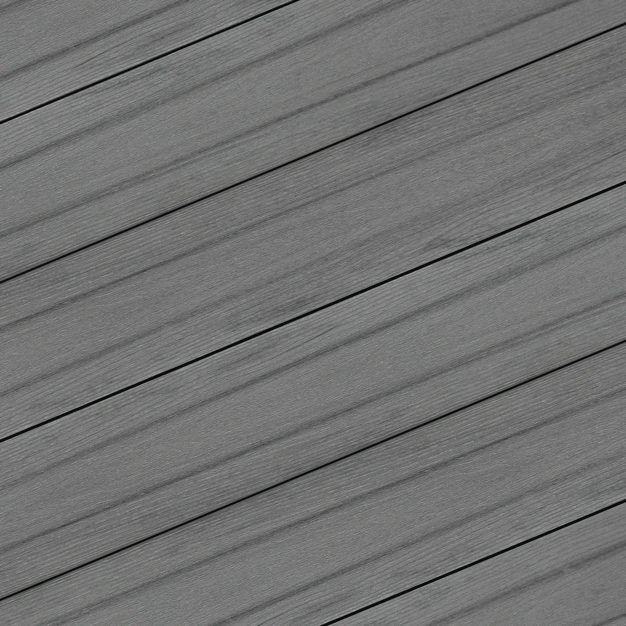 Gray composite decking planks with wood grain texture for outdoor patios and walkways