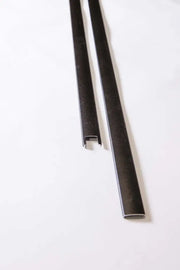 Black metal U-channel strips for industrial equipment and manufacturing applications