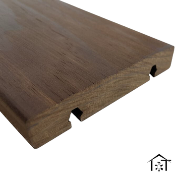 Close-up side view of a Kebony Clear Click-In decking board in dark brown modified wood, highlighting tongue-and-groove edges and pre-cut grooves for hidden clip-in fastening system